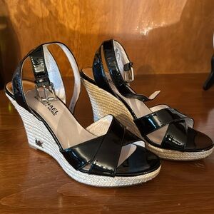Michael Kors patent leather wedge sandal with ankle strap.